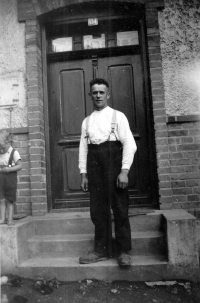 Father Josef Matuška in front of his house in Hati. Then with the number 134