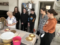 Ludmila Krystyníková teaches a team of pupils from the Nový Malín Primary School and Kindergarten to bake frgals, January 2024