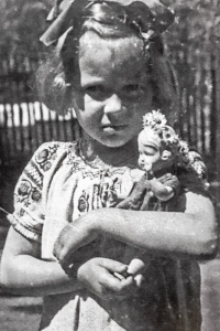 Rostislava Raidová, about three years old, with a doll in her arms. Photograph from the period 1944-1945