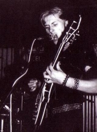 As a guitarist during a concert with the FPB, second half of the 80s