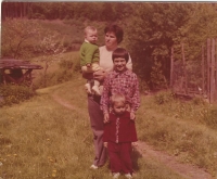 Miloslava Kořínková with her three children - Karel, Vít and Štěpánka in Zahrádka in 1976