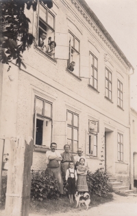 Höfner Family before WWII - grandfather Karl, grandmother Rosalia, great grandfather, father Walter, aunt Kasalia, in window uncle Pepi, aunt Maria, uncle Rudi