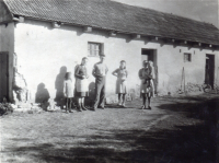 Glajch in front of his father's carpentry workshop in Straklov