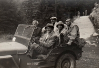 Mother and father in a UNRRA jeep, 1947