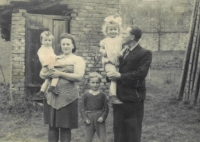 Antonie in her father's arms with her mother, older brother Jaroslav and younger sister Anna in 1945