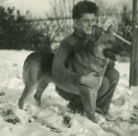 Jiří Hübner in his childhood with a dog