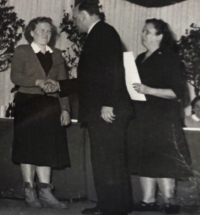 Marie Prchalová accepts the award at the International Women's Day celebrations