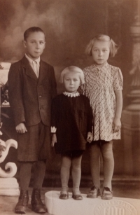 with siblings (third from the left)