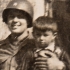 Roland Waclav as a child in the lap of an American soldier, Všeruby, May 1945